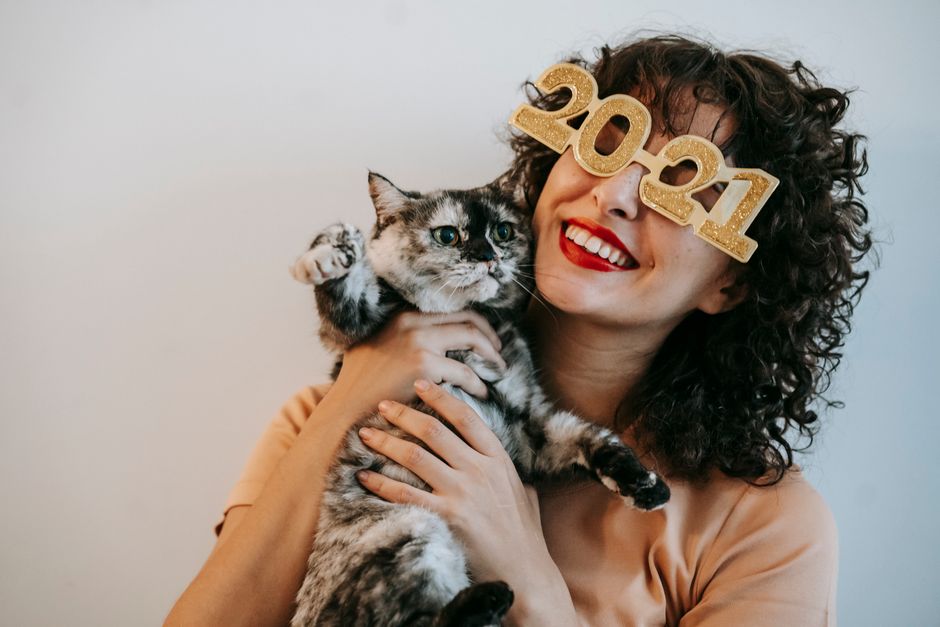 A happy new owner with a cat adopted in Escondido, CA
