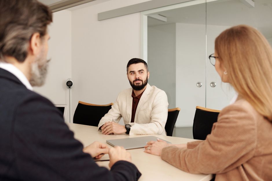 An HR team discussing a volunteer time off benefits program