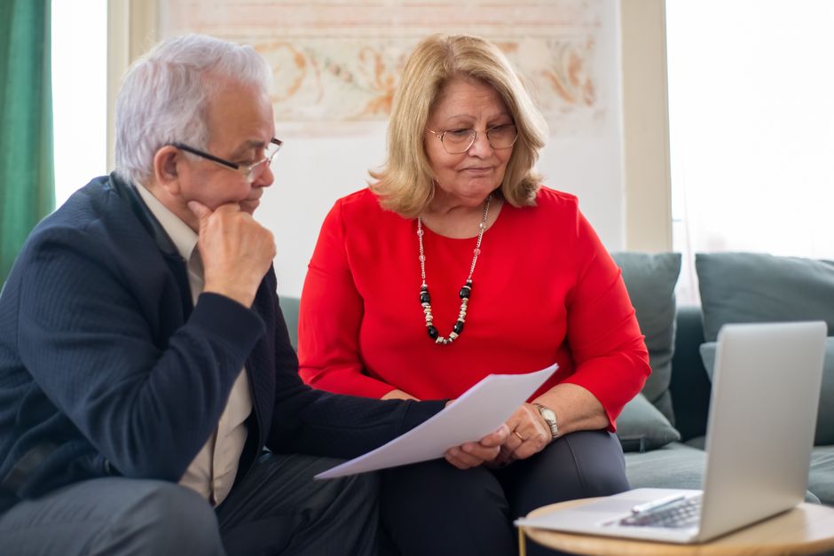 A couple reviewing planned giving documents at home