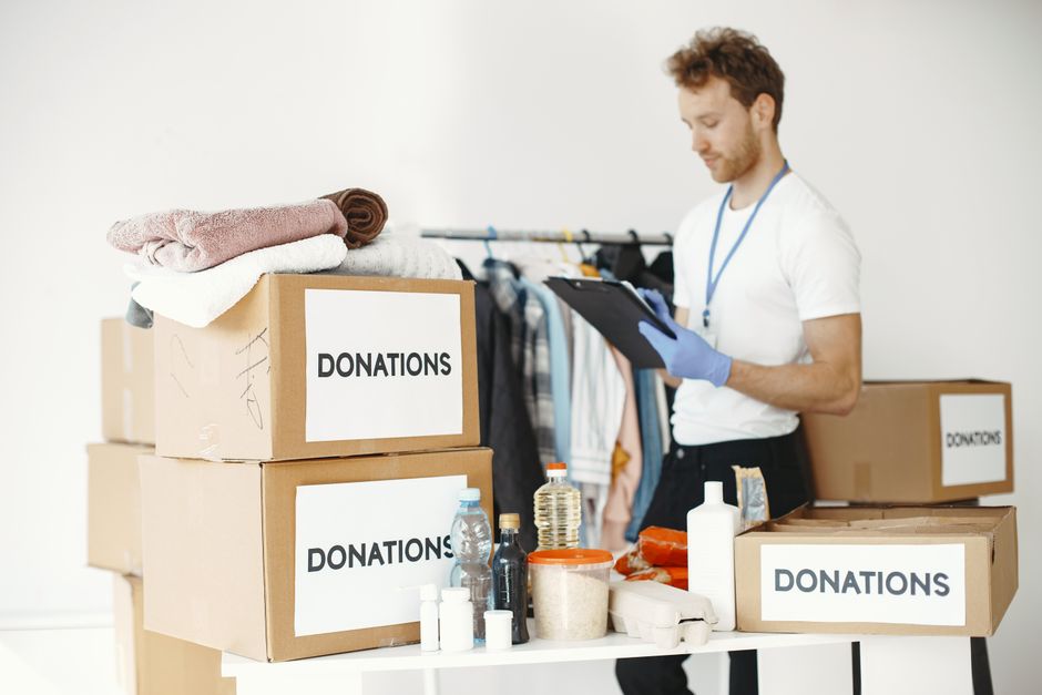 A volunteer sorting donated supplies at a rescue organization