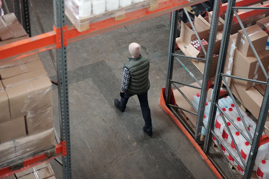 A working cat helping with rodent control in a warehouse setting