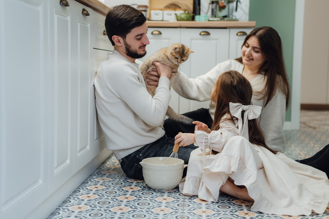 A family meeting a cat during an adoption counselling session