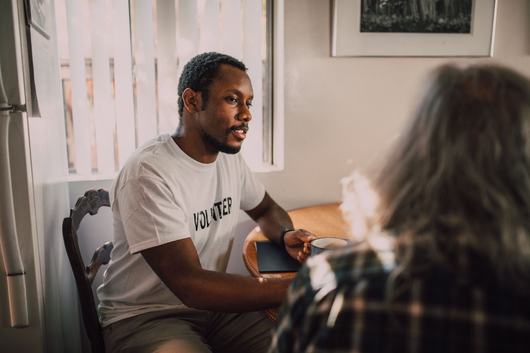 An experienced carer mentoring a new foster volunteer