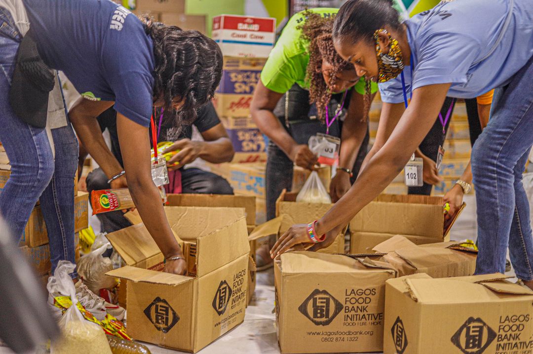 Volunteers sorting donations at a community pet food pantry
