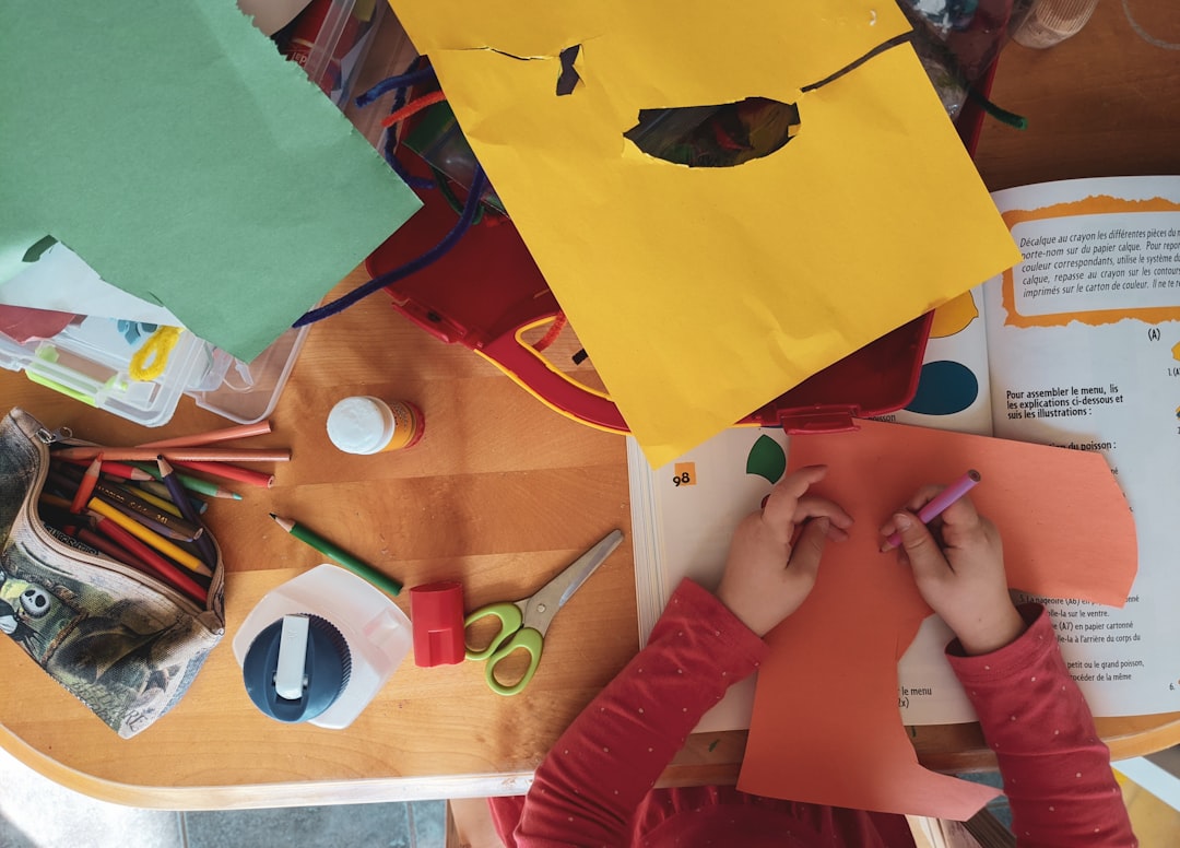 Children making toys and blankets to donate to a cat rescue