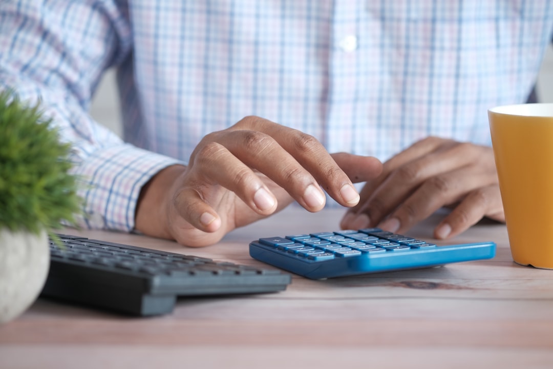 Comparing spay and neuter costs and clinic paperwork at a kitchen table